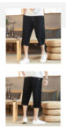 hmnskd116 tang suit black side walking.jpg