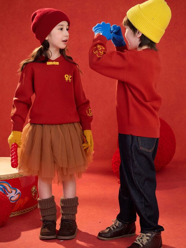 kids festive sweater new year playful moment 3.jpg